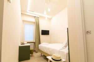 A bed or beds in a room at Migliori Olive Ascolane beds