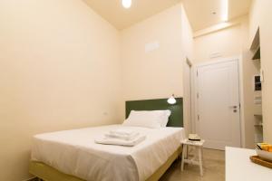 A bed or beds in a room at Migliori Olive Ascolane beds