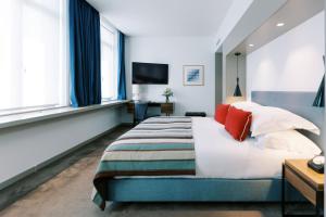 Ένα ή περισσότερα κρεβάτια σε δωμάτιο στο The Editory Artist Baixa Porto Hotel