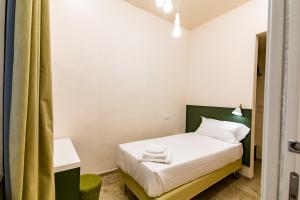 A bed or beds in a room at Migliori Olive Ascolane beds