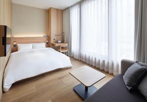 Postel nebo postele na pokoji v ubytování MUJI HOTEL GINZA