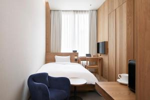 TV a/nebo společenská místnost v ubytování MUJI HOTEL GINZA