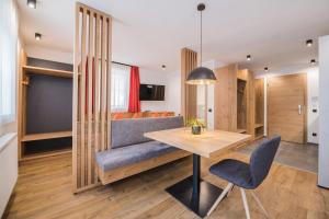 A television and/or entertainment centre at Kuenz Dolomites App 2