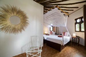 Postel nebo postele na pokoji v ubytování Antonio Beach Tree House Hotel & Spa