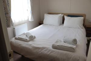 En eller flere senge i et værelse på Sycamore Farm Park