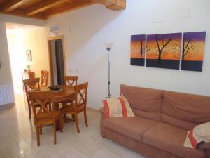 a living room with a couch and a table at Ciudad Jardin in Peñíscola