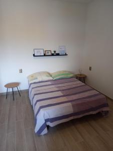 a bedroom with a bed and a table in it at Apartment Karmen in Sumartin