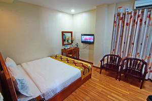 TV a/nebo společenská místnost v ubytování Royal Pearl Hotel