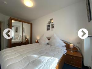 Giường trong phòng chung tại Villa Döser Strand Wohnung 5