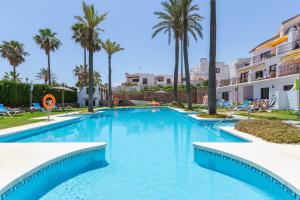 The swimming pool at or close to marina real 221