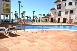 The swimming pool at or close to marina real 221