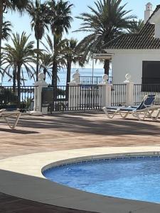 The swimming pool at or close to marina real 221
