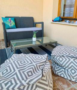 a living room with a couch and a coffee table at Small Lake Apartman in Esztergom