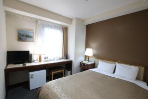Postel nebo postele na pokoji v ubytování Hotel Aston Hotel Osaka Sakai