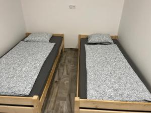A bed or beds in a room at Rajczi Apartman
