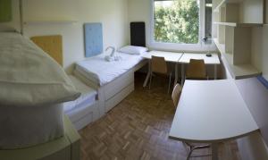 Postel nebo postele na pokoji v ubytování Hostel DIC