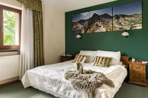 Posteľ alebo postele v izbe v ubytovaní Willa Kocham Tatry