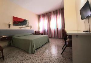 Ένα ή περισσότερα κρεβάτια σε δωμάτιο στο Hotel Paraíso