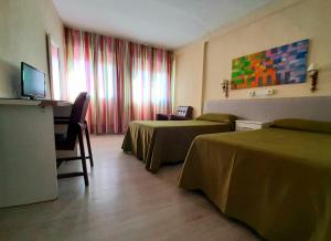 Postel nebo postele na pokoji v ubytování Hotel Paraíso
