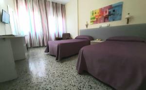 Postel nebo postele na pokoji v ubytování Hotel Paraíso