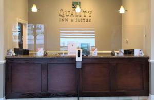 a store front with a wooden counter in a store at Quality Inn & Suites 1000 Islands in Gananoque