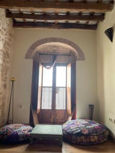 Postel nebo postele na pokoji v ubytování La Casita de la Muralla + 5 fotografií