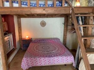 A bed or beds in a room at La Casita de la Muralla