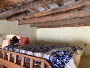 A bed or beds in a room at La Casita de la Muralla