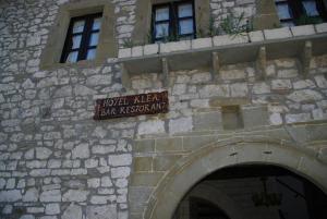 a sign on the side of a stone building at Hotel Klea in Berat