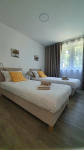 Postel nebo postele na pokoji v ubytování Divine View Apartma