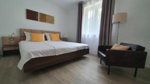 Postel nebo postele na pokoji v ubytování Divine View Apartma