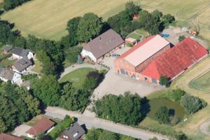 an aerial view of a building with a red roof at Ferienwohnung "Seestern" in Hinrichsdorf