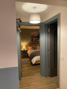 A bed or beds in a room at Natures Rest Apartment