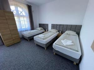 Posteľ alebo postele v izbe v ubytovaní Villa Stary Kalisz
