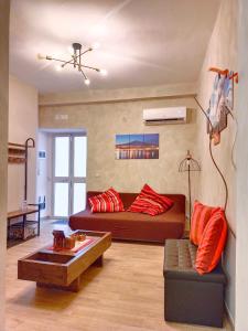 Et opholdsområde på EtnaCiTy Guest House Apartment