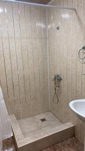 a bathroom with a shower with a sink at Gyumri house in Gyumri