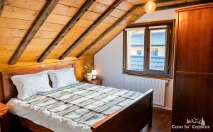 Postel nebo postele na pokoji v ubytování Casa lu` Cojocar
