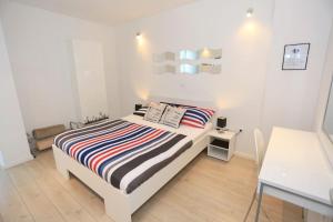 Posteľ alebo postele v izbe v ubytovaní Cardo Apartments