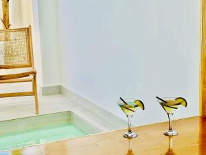 two birds sitting on top of a wooden table at Canaryislandshost l Boya Suites in Playa Honda