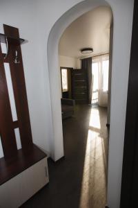 a hallway with an archway in a house at Meretskova Apartment in Velikiy Novgorod