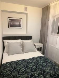 Postel nebo postele na pokoji v ubytování Apartamenty u Ewy - EUROS