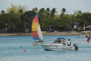 a group of people on a boat in the water at Sandy Bliss Condominiums in Saint James
