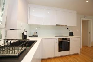 Kuchyň nebo kuchyňský kout v ubytování Apartment Volat