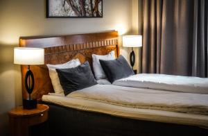 Postel nebo postele na pokoji v ubytování First Hotel Millennium