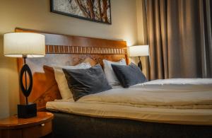 Postel nebo postele na pokoji v ubytování First Hotel Millennium