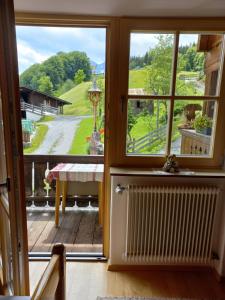 a room with a window and a view of a yard at Ferienzimmer Brennerbauer in Lofer