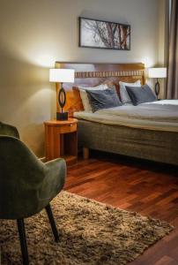 Postel nebo postele na pokoji v ubytování First Hotel Millennium