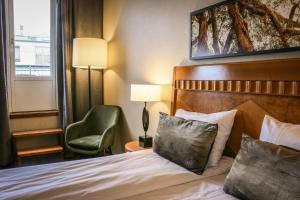 Postel nebo postele na pokoji v ubytování First Hotel Millennium