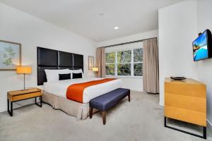 a hotel room with a large bed and a window at Regal Oaks Resort Townhouse in Kissimmee