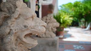 a statue of a dog with its mouth open at RESIDENCE SOLARIDE apartments, FREE PRIVATE PARKING WITH VIDEOSURVELLIANCE and SHUTTLE SERVICE in Salerno